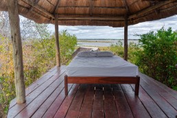 A daybed with a view to the Zambezi River in Royal Zambezi Lodge.